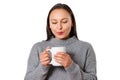 Young smiling brunette woman girl in a warm sweater with a cup of hot coffee. on white Royalty Free Stock Photo