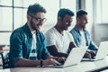 Young Smiling Business People Working on Laptops Royalty Free Stock Photo