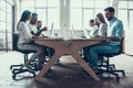 Young Smiling Business People Working on Laptops Royalty Free Stock Photo