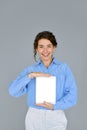 Smiling business woman holding digital tablet computer showing mock up screen. Royalty Free Stock Photo