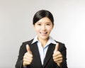 Young smiling business woman with thumb up gesture Royalty Free Stock Photo