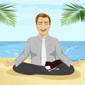 Young smiling businessman doing yoga on tropical beach Royalty Free Stock Photo