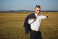 A young smiling businessman goes with his indexed finger up. It symbolizes attention. Be vigilant Royalty Free Stock Photo