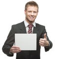 Young smiling businessman holding sign Royalty Free Stock Photo