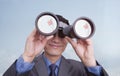 Young smiling businessman looking through binoculars, reflection of Chinese flag, Beijing, China Royalty Free Stock Photo