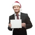 Young smiling businessman in santa hat holding sign Royalty Free Stock Photo