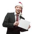 Young smiling businessman in santa hat holding sign Royalty Free Stock Photo