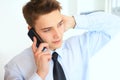 Young smiling businessman talking on cell phone Royalty Free Stock Photo