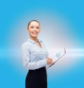 Young smiling businesswoman with clipboard and pen Royalty Free Stock Photo