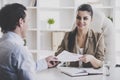 Young Smiling Businesswoman Interviewing Employee. Royalty Free Stock Photo