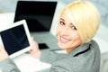 Young smiling businesswoman sitting at her workplace Royalty Free Stock Photo