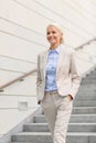 Young smiling businesswoman walking down stairs Royalty Free Stock Photo