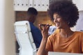 Young Smiling Businesswoman Working At Desk In Office Talking Into Mic Of Mobile Phone Royalty Free Stock Photo