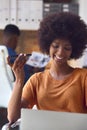 Young Smiling Businesswoman Working At Desk In Office Talking Into Mic Of Mobile Phone Royalty Free Stock Photo