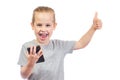 Young smiling caucasian boy with mobile phone shows thumbs up Royalty Free Stock Photo