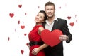 Young smiling caucasian couple holding red heart Royalty Free Stock Photo