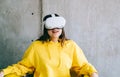 Young smiling caucasian woman using VR headset, looking up in virtual reality Royalty Free Stock Photo