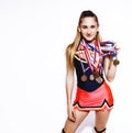 young smiling cheerleader girl with golden cups and price medals isolated on white background, lifestyle sport people Royalty Free Stock Photo