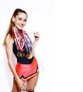 young smiling cheerleader girl with golden cups and price medals isolated on white background, lifestyle sport people Royalty Free Stock Photo