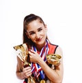 young smiling cheerleader girl with golden cups and price medals isolated on white background, lifestyle sport people Royalty Free Stock Photo