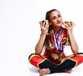 young smiling cheerleader girl with golden cups and price medals isolated on white background, lifestyle sport people Royalty Free Stock Photo