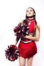 Young smiling cheerleader girl isolated on white background