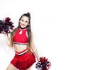 Young smiling cheerleader girl isolated on white background