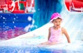 Young smiling child having fun in aquapark Royalty Free Stock Photo