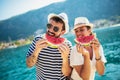 Smiling couple eating watermelon on the beach having fun Royalty Free Stock Photo