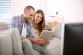 Young smiling couple having fun at home