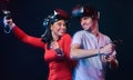 Young smiling couple having fun together, play with VR headsets and controllers. Royalty Free Stock Photo