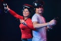 Young smiling couple having fun together, play with VR headsets and controllers. Royalty Free Stock Photo