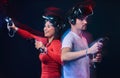 Young smiling couple having fun together, play with VR headsets and controllers. Royalty Free Stock Photo