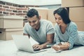 Young Smiling Couple Shopping Online on Laptop Royalty Free Stock Photo