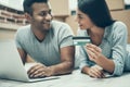 Young Smiling Couple Shopping Online on Laptop Royalty Free Stock Photo