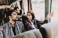 Young Smiling Couple Traveling on Tourist Bus