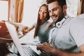 Young Smiling Couple Using Laptop in Tour Bus Royalty Free Stock Photo