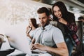 Young Smiling Couple Using Laptop in Tour Bus Royalty Free Stock Photo