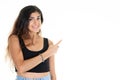 Young smiling cute woman pointing side hand finger at copyspace looks in camera Royalty Free Stock Photo