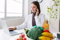 Young smiling dietitian woman working at consultation room