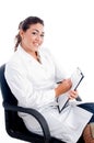 Young smiling doctor sitting on chair Royalty Free Stock Photo