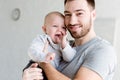 young smiling father holding little baby boy Royalty Free Stock Photo