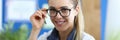 Young smiling female doctor holds medicine in her hand Royalty Free Stock Photo