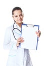 Young smiling female doctor showing blank clipboard Royalty Free Stock Photo