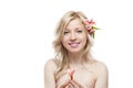 Young smiling female with flower in hair Royalty Free Stock Photo
