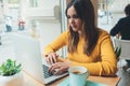 Young smiling female making video call with her colleagues Royalty Free Stock Photo