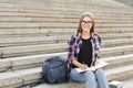 Young student girl making notes in notebook Royalty Free Stock Photo