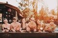 Young Smiling Friends with Cocktails at Poolside Royalty Free Stock Photo