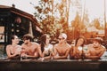 Young Smiling Friends with Cocktails at Poolside Royalty Free Stock Photo