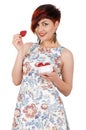 Young smiling girl eating strawberries. Royalty Free Stock Photo